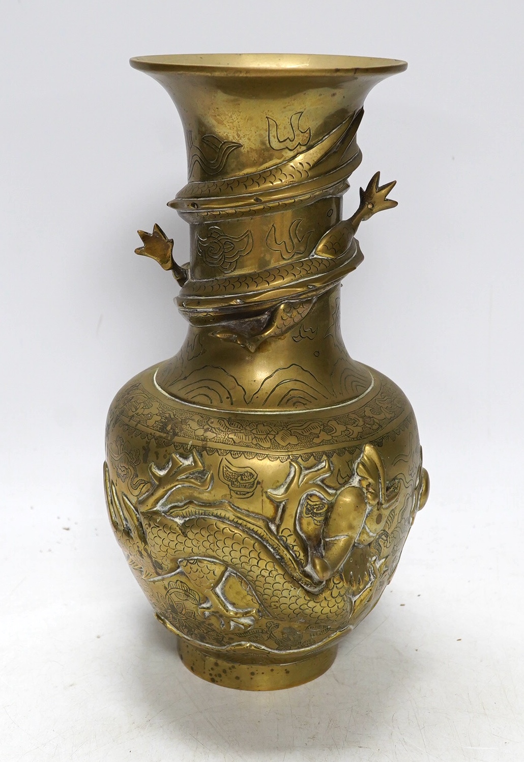 An early 20th century Chinese bronze 'dragon' vase, 25cm. Condition - fair to good